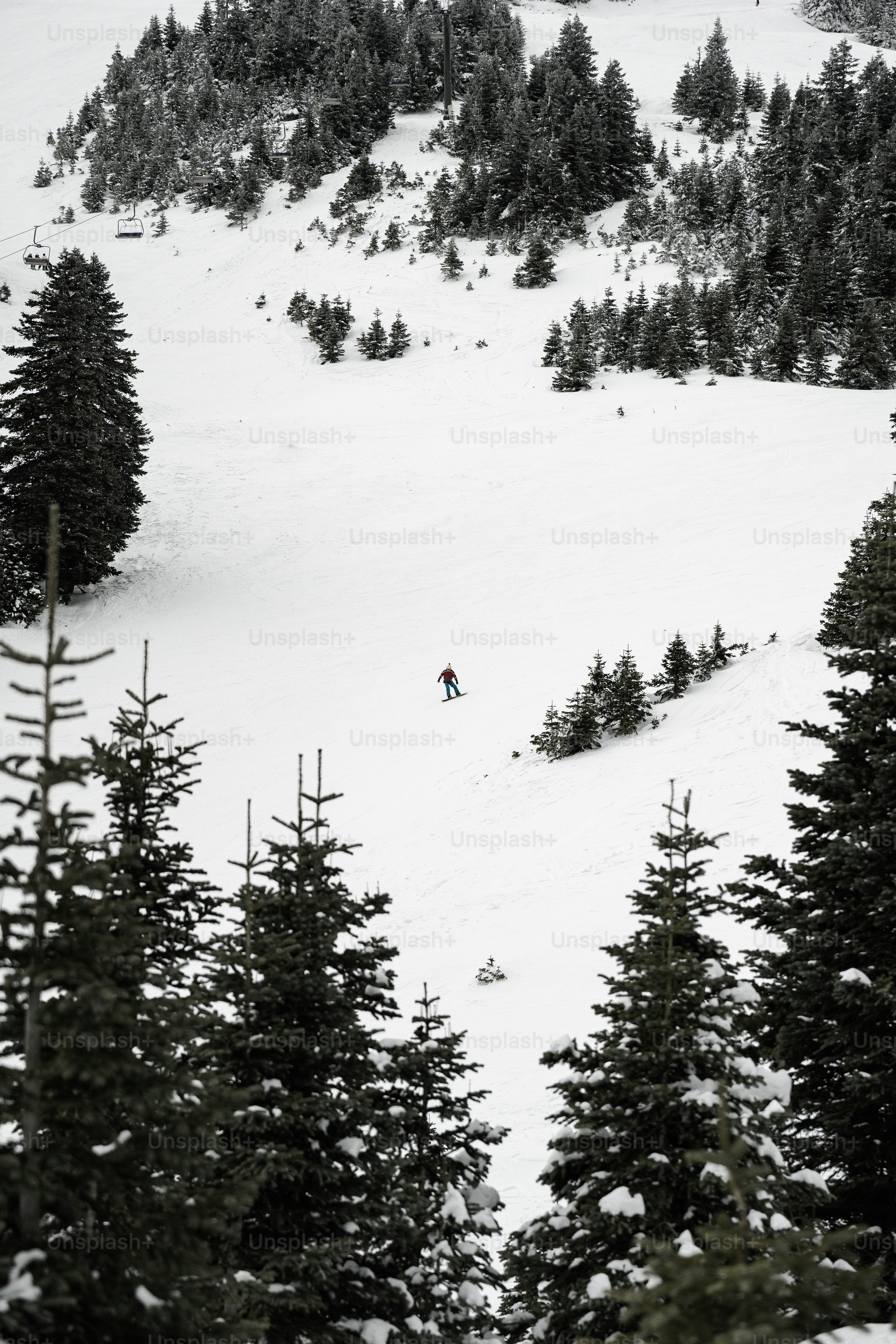 a person riding skis down a snow covered slope